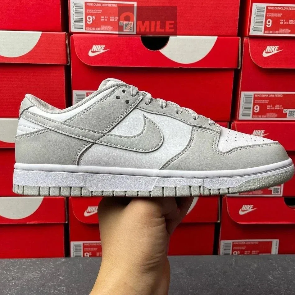 Grey and white sneakers representing a listing with ten recorded QC photos